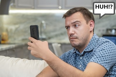 Confused Man Betting on Phone